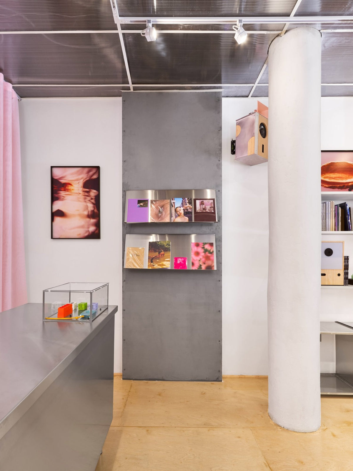 Photo books and zines on steel shelves